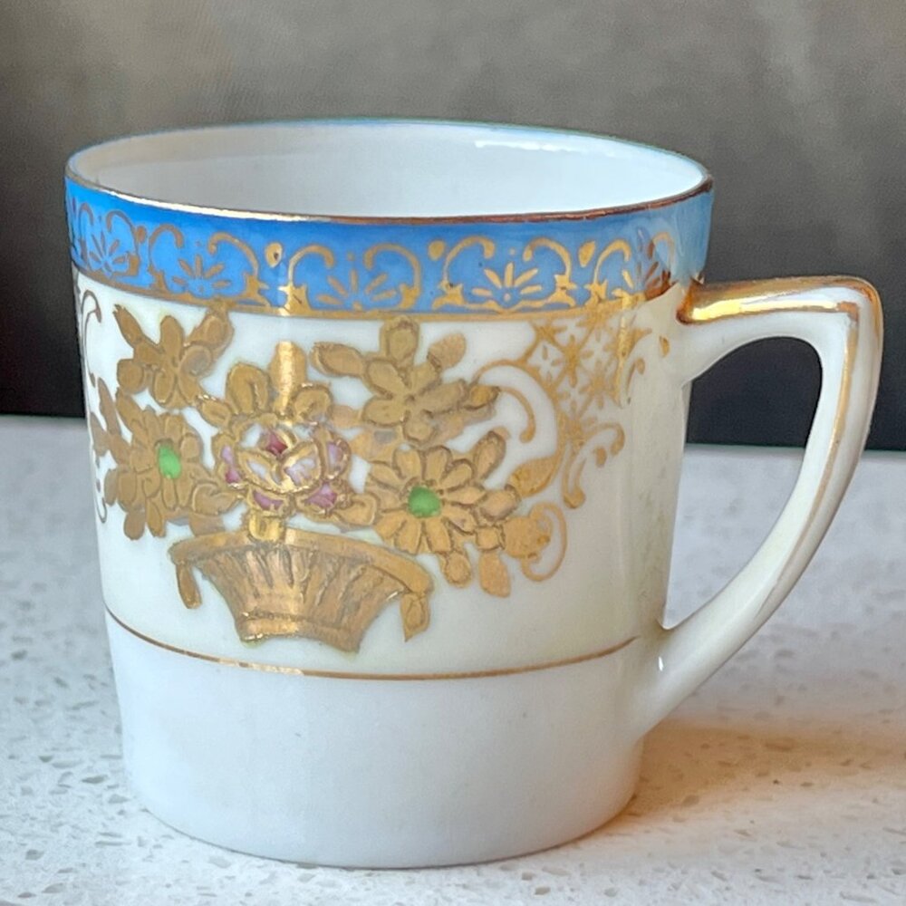 SGK China Porcelain Demitasse Cup With Gold Floral & Blue Band Design Occupied J